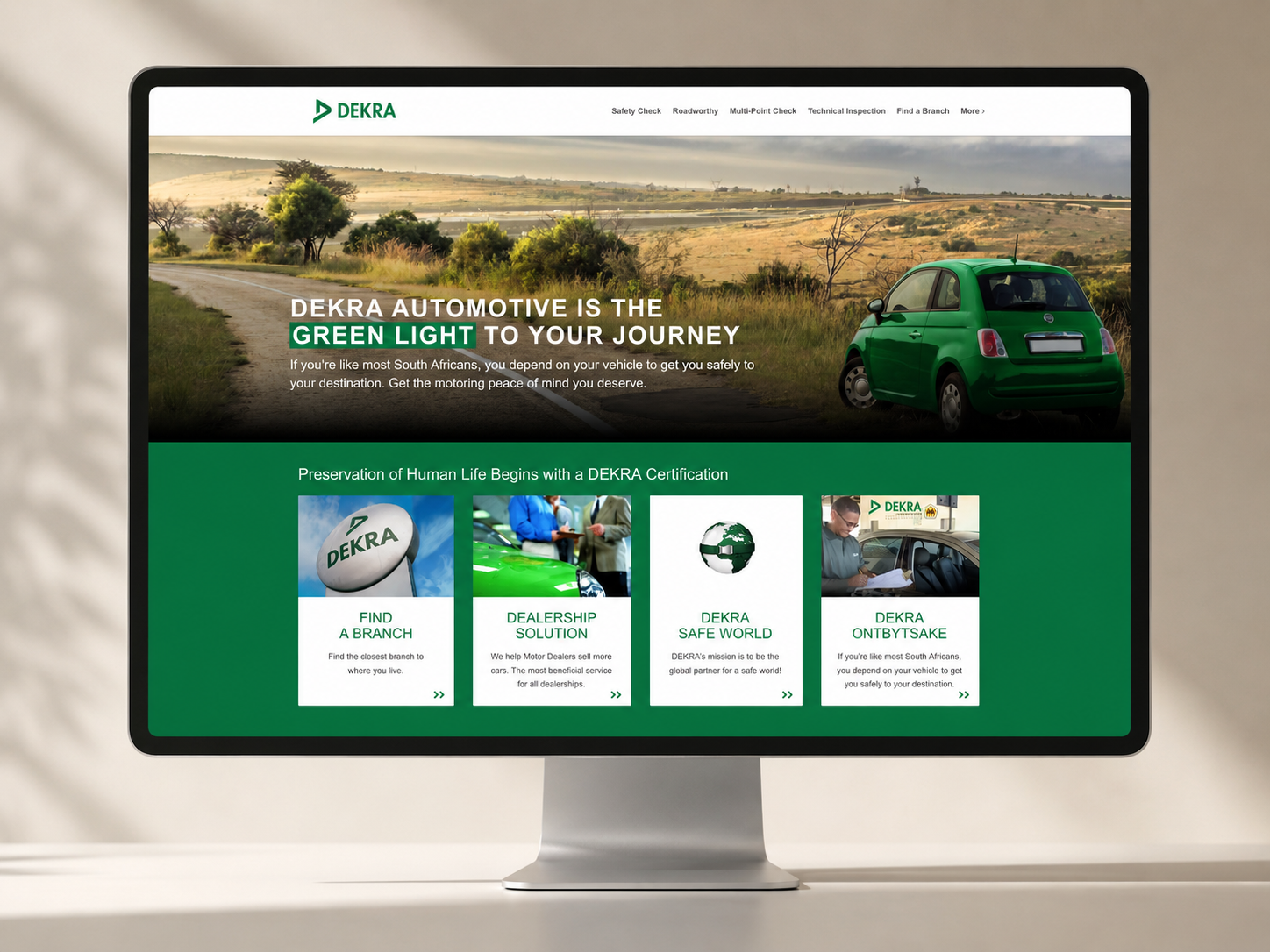 Desktop website mockup for DEKRA automotive with green brand accents and a scenic hero image.